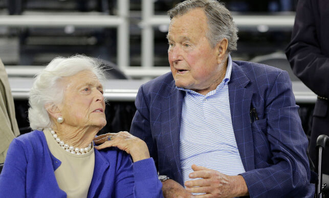 FILE - In this March 29, 2015, file photo, former President George H.W. Bush and his wife Barbara Bush, left, speak before a college basketball regional final game between Gonzaga and Duke, in the NCAA basketball tournament in Houston. A family spokesman said Sunday, April 15, 2018, that the former first lady Barbara Bush is in "failing health" and won't seek additional medical treatment. (AP Photo/David J. Phillip, File)
